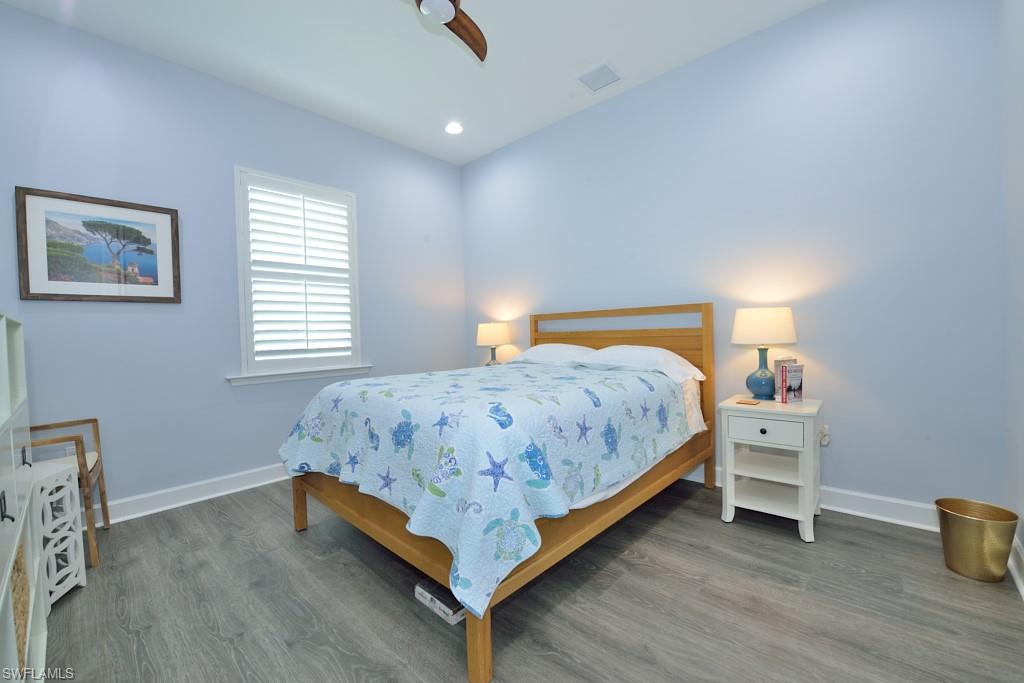 7299 Cayo Coco Lane Naples, FL 34113 - Photo 5 of 18 a bedroom with a bed and window