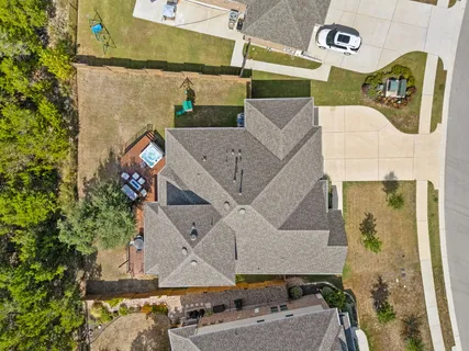 an aerial view of a house with swimming pool