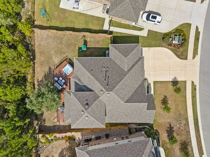 front view of a house with a bench