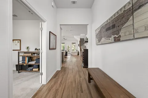 a view of a kitchen from the hallway