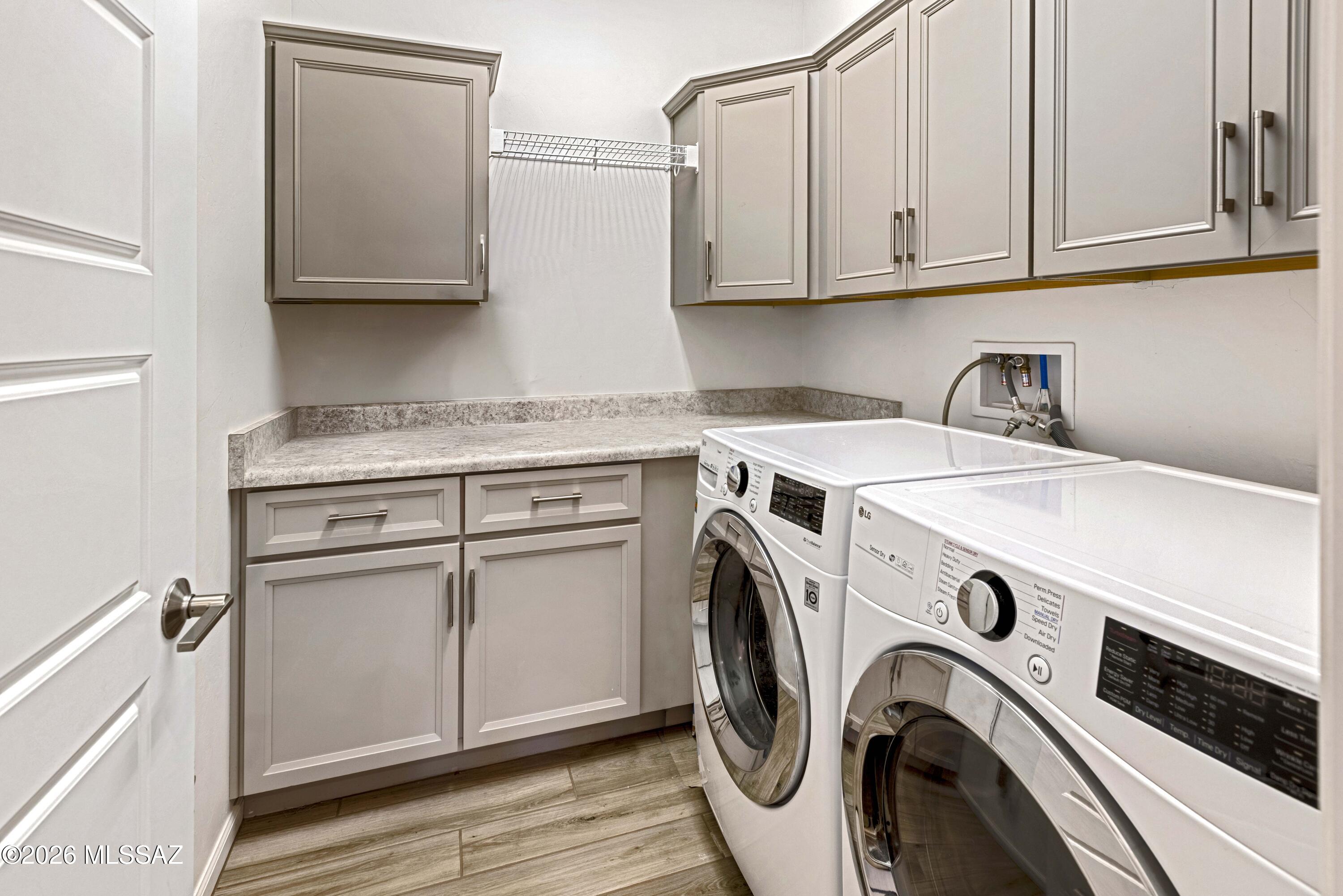 61347 East Shale Road Oracle, AZ 85623 - Photo 23 of 40 Laundry room with extra cabinets