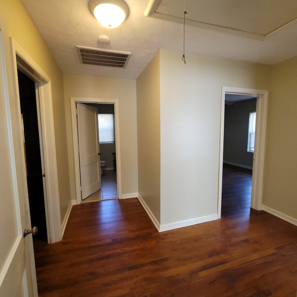 1547 38th Street Columbus, GA 31904 - Photo 13 of 24 a view of a hallway with wooden floor