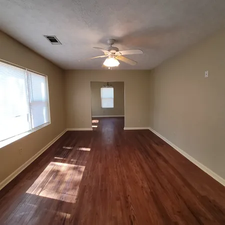 a view of workspace with wooden floor and window
