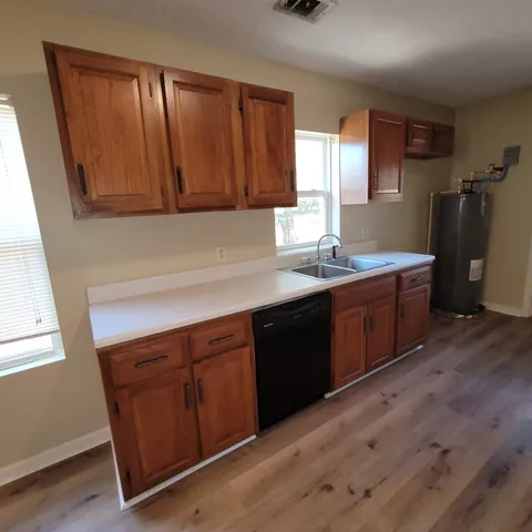 a kitchen with a sink and cabinets