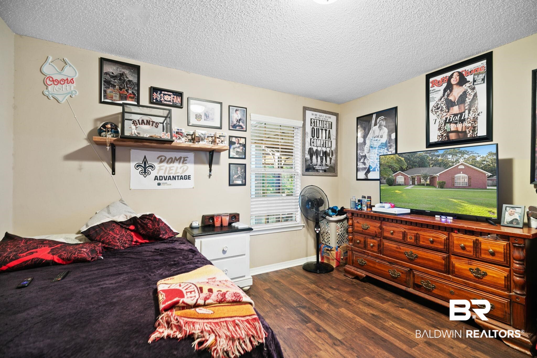 10550 Patrick Avenue Grand Bay, AL 36541 - Photo 34 of 43 Bedroom with dark wood-type flooring and a textured ceiling