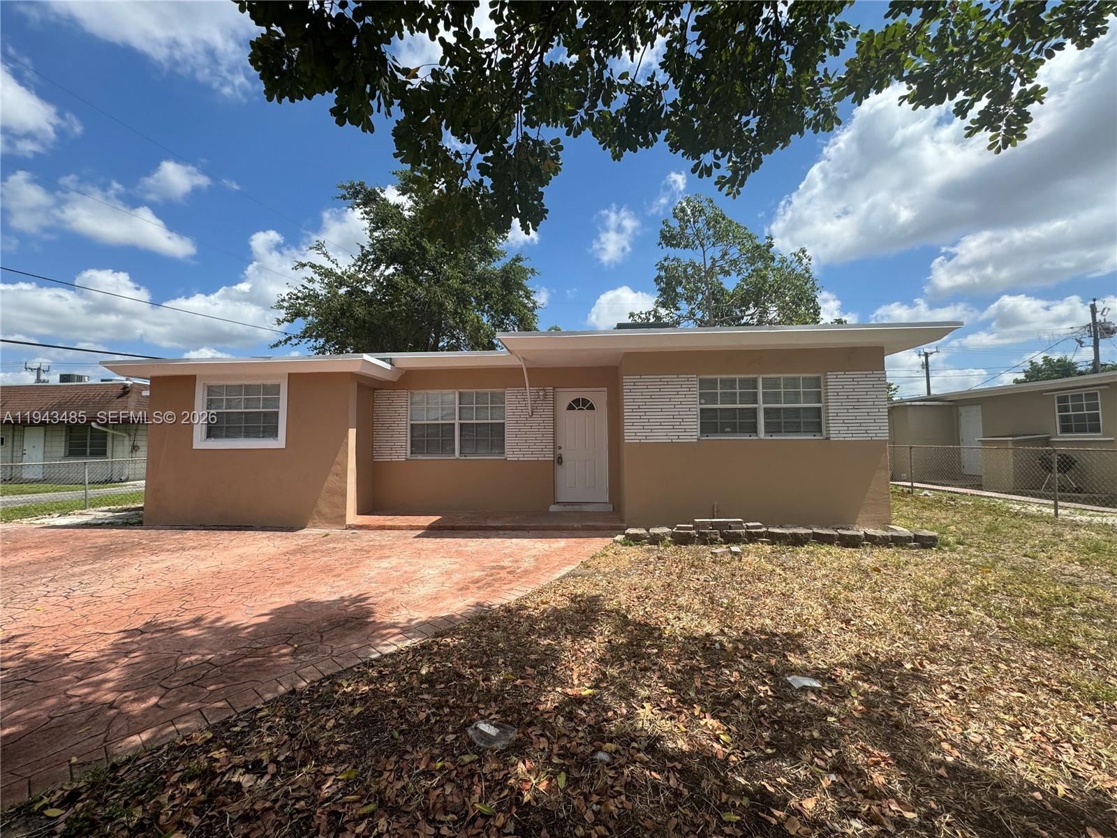 5819 Moseley Street Hollywood, FL 33021 - Photo 1 of 15 a view of a house with a yard