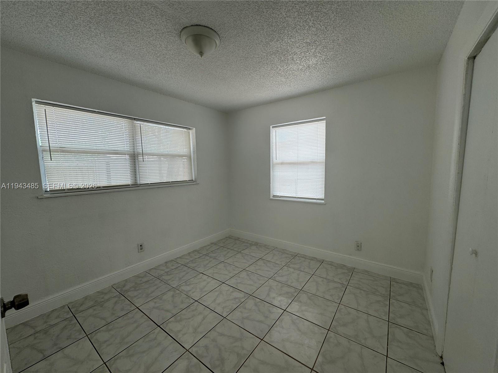5819 Moseley Street Hollywood, FL 33021 - Photo 12 of 15 an empty room with windows