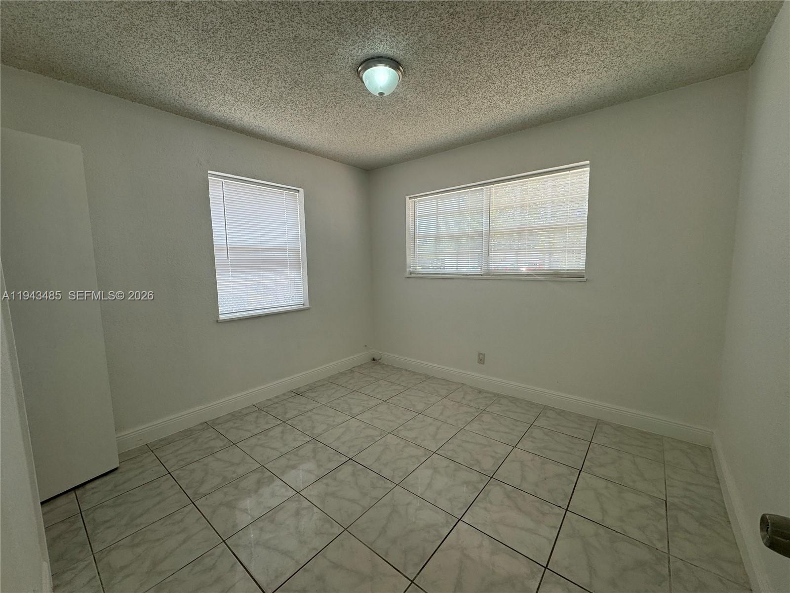 5819 Moseley Street Hollywood, FL 33021 - Photo 13 of 15 an empty room with windows