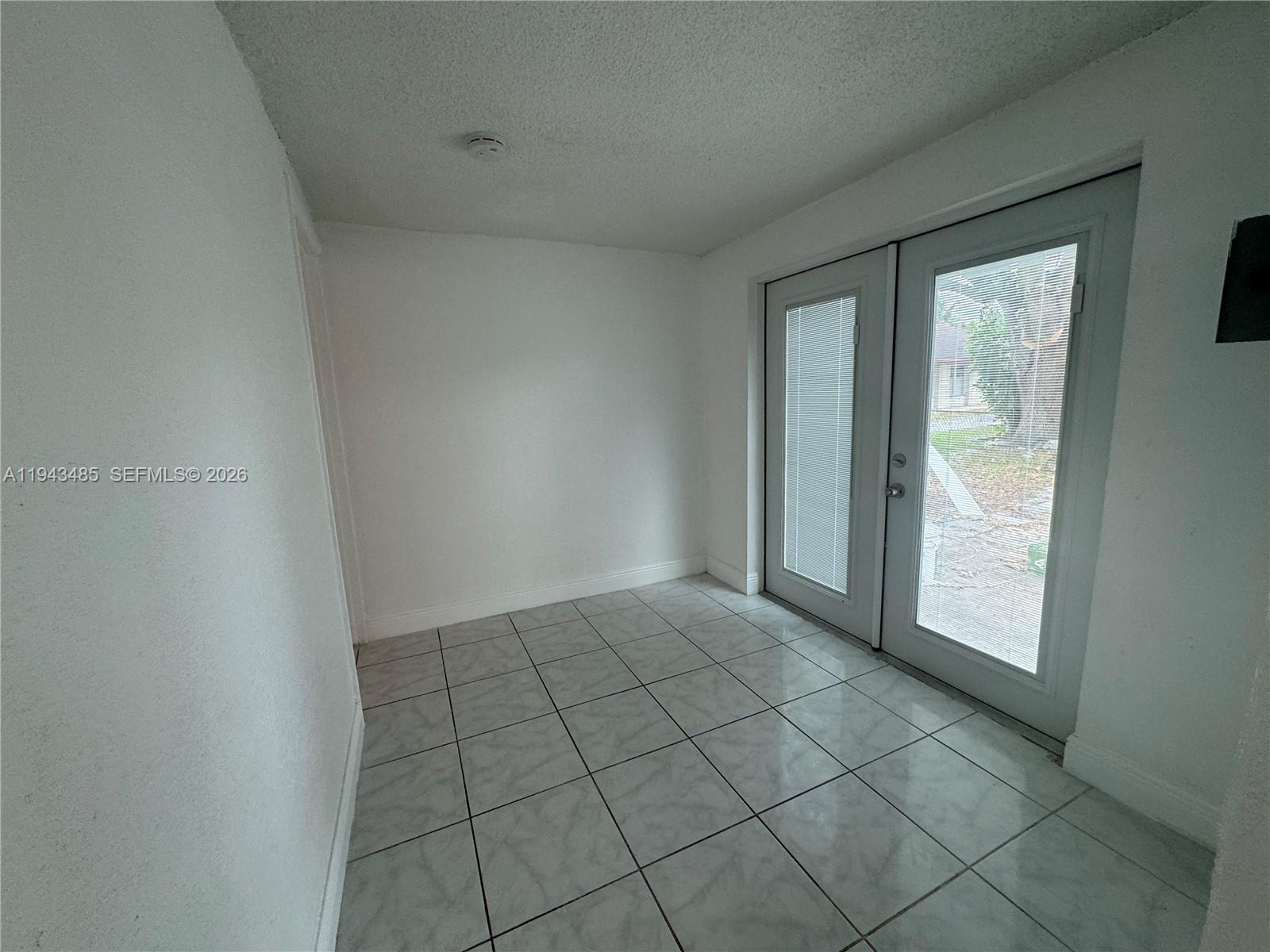 5819 Moseley Street Hollywood, FL 33021 - Photo 6 of 15 a view of an empty room and window