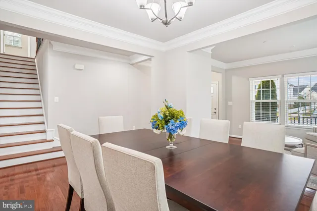 a large kitchen with stainless steel appliances granite countertop a stove a sink dishwasher and a refrigerator