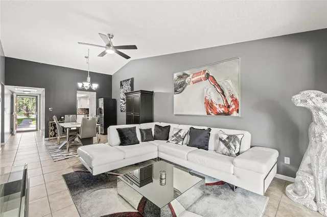 a living room with furniture and a table