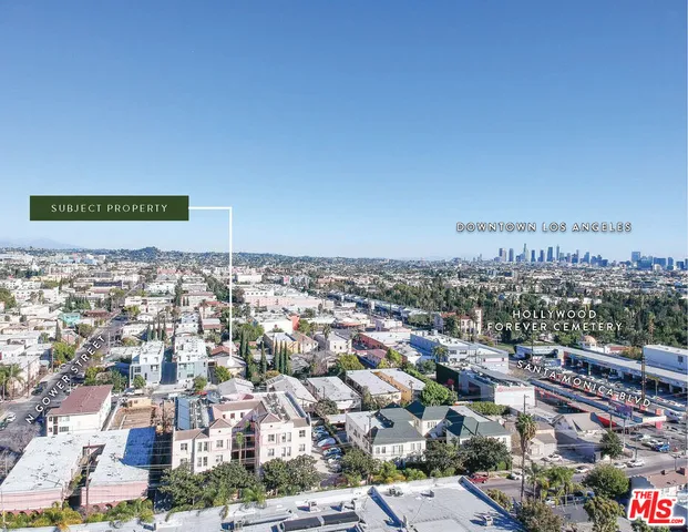 an aerial view of residential houses and outdoor space
