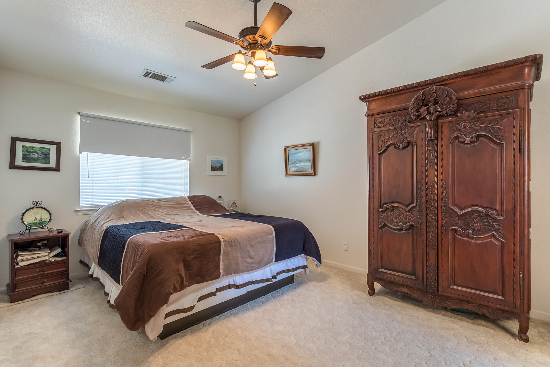 4301 Panorama Point Road Cottonwood, CA 96022 - Photo 11 of 20 a bedroom with a bed and a chandelier