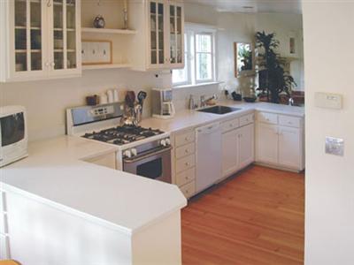 720 Alta Vista Road Mill Valley, CA 94941 - Photo 5 of 11 a kitchen with a stove a sink and a refrigerator