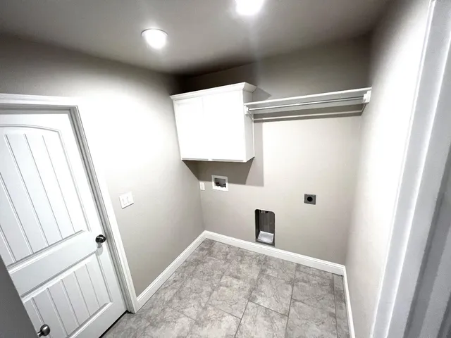 a kitchen with stainless steel appliances granite countertop a refrigerator stove top oven and sink