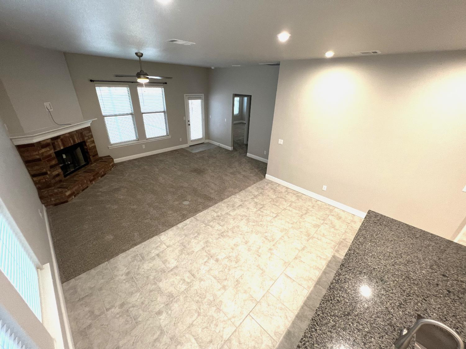 7506 100th Street Lubbock, TX 79424 - Photo 14 of 23 an empty room with windows