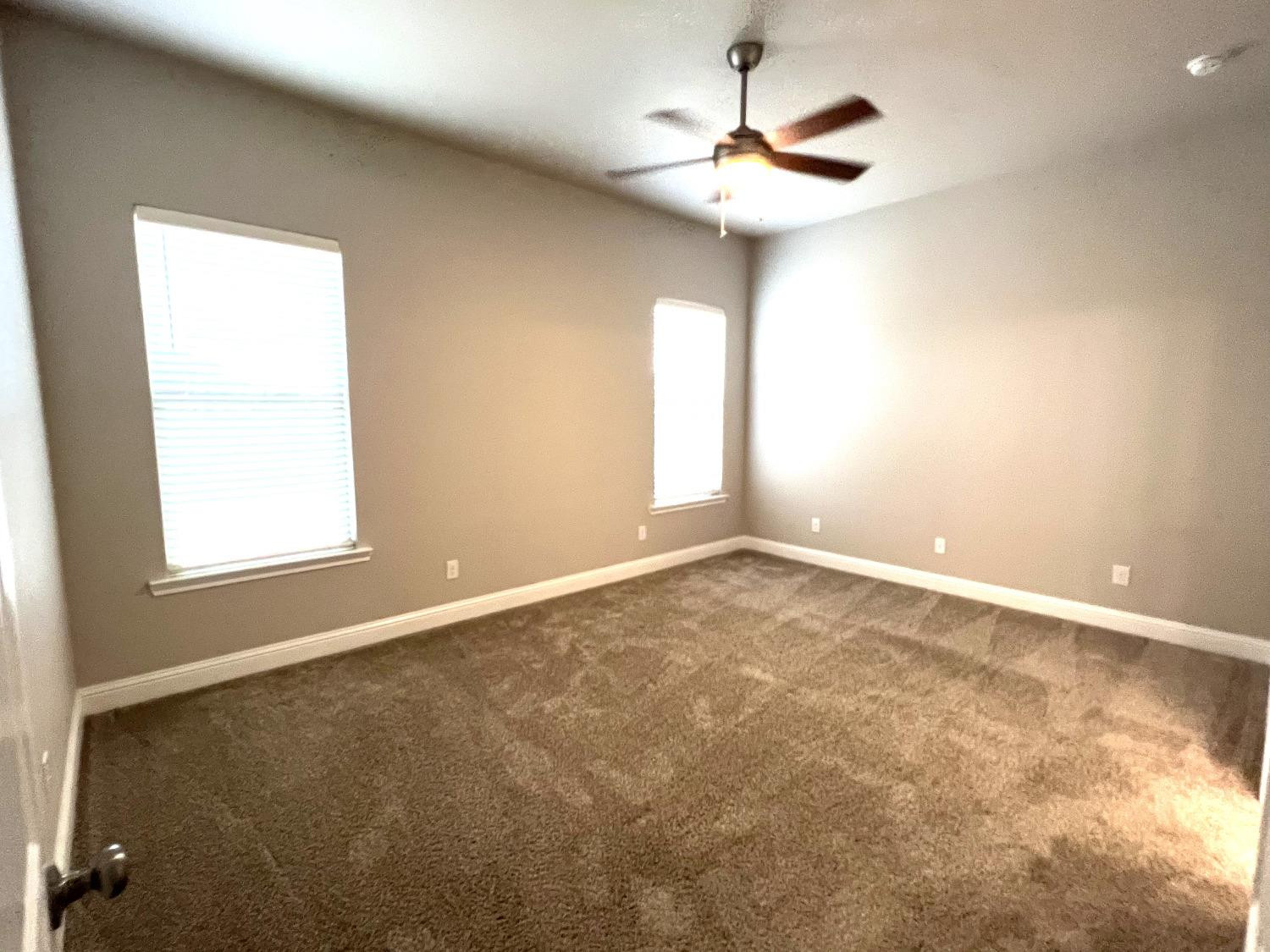 7506 100th Street Lubbock, TX 79424 - Photo 16 of 23 an empty room with a window