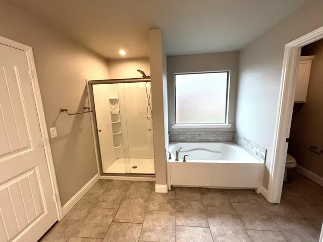 a view of a hallway with washer and dryer
