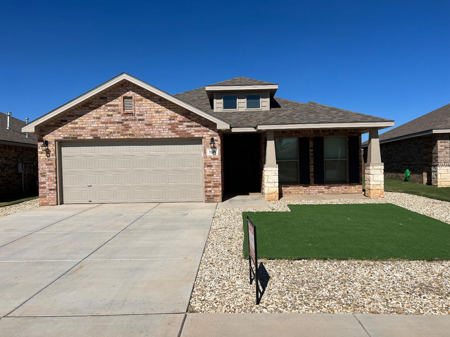 7506 100th Street Lubbock, TX 79424 - Photo 23 of 23 a front view of a house with a yard and porch