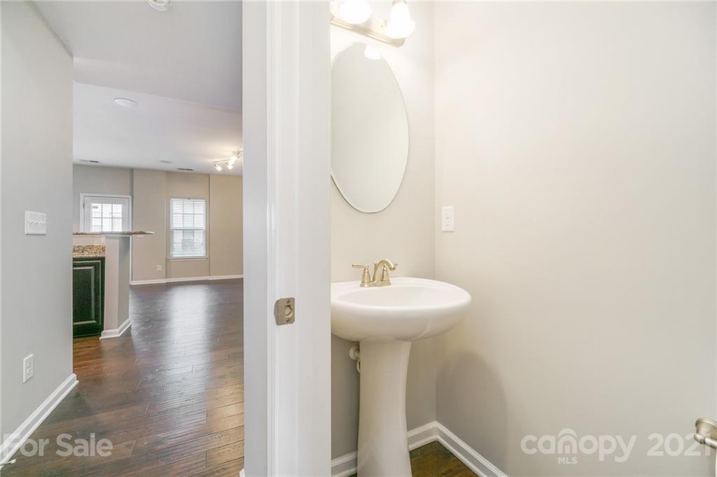 7304 Copper Beech Trace, Unit 13 Charlotte, NC 28273 - Photo 11 of 25 a bathroom with a sink and mirror