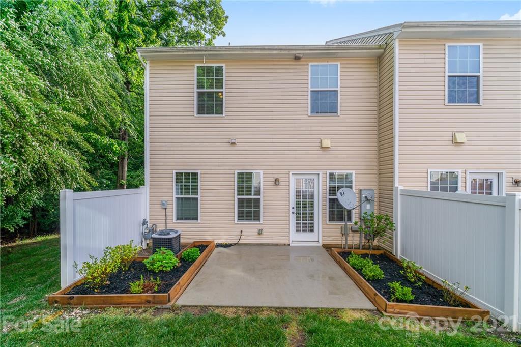7304 Copper Beech Trace, Unit 13 Charlotte, NC 28273 - Photo 22 of 25 a view of a house with backyard and garden