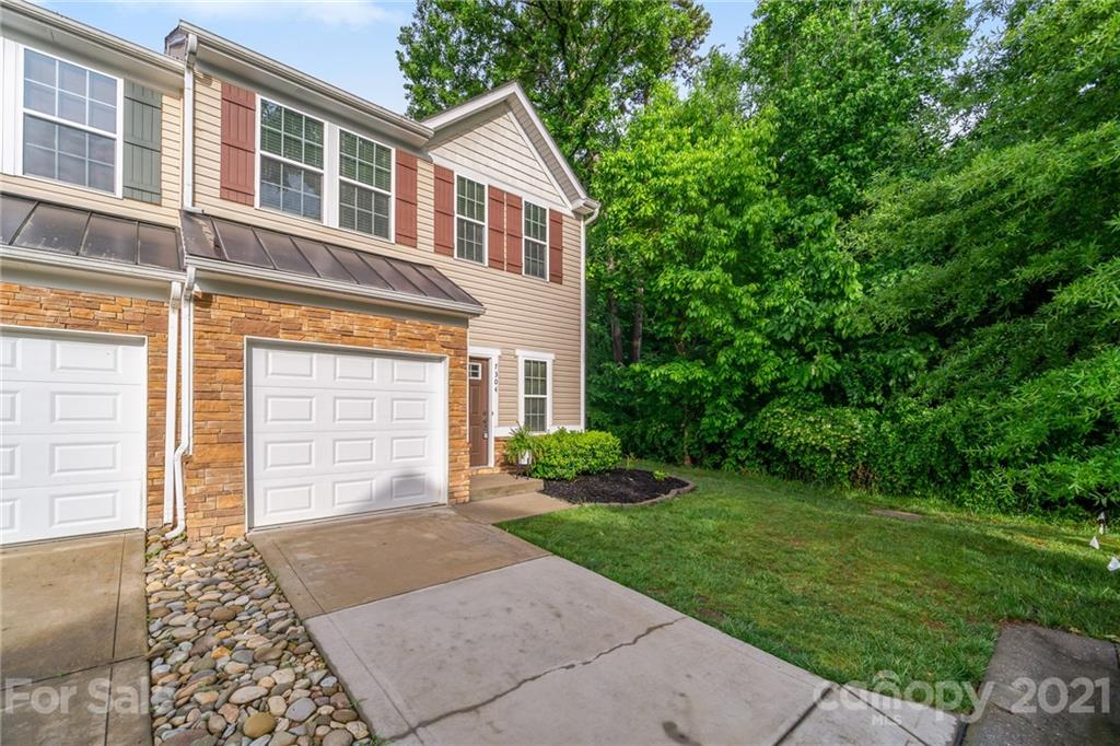 7304 Copper Beech Trace, Unit 13 Charlotte, NC 28273 - Photo 25 of 25 a front view of a house with a yard