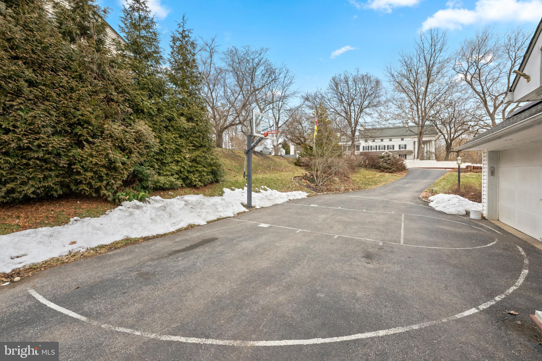 714 Gulph Road Wayne, PA 19087 - Photo 3 of 48 Private driveway with basketball hoop.
