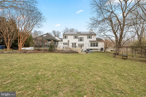 a front view of a building with a yard