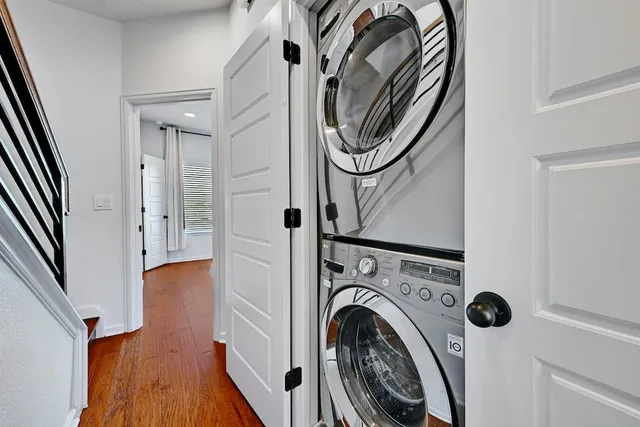 a view of a hallway with washer and dryer