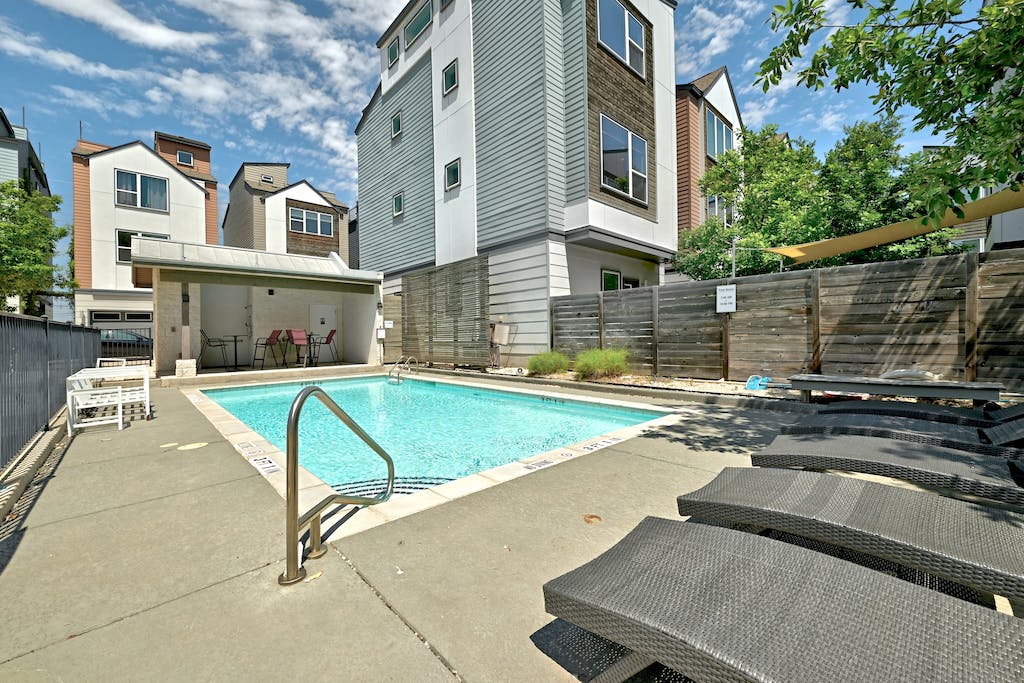 1412 Waterloo Shore Lane Austin, TX 78741 - Photo 26 of 30 a view of a white building with a swimming pool