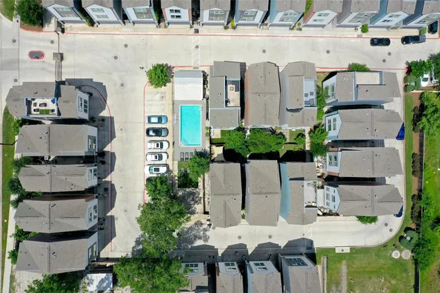 a balcony with table and chairs