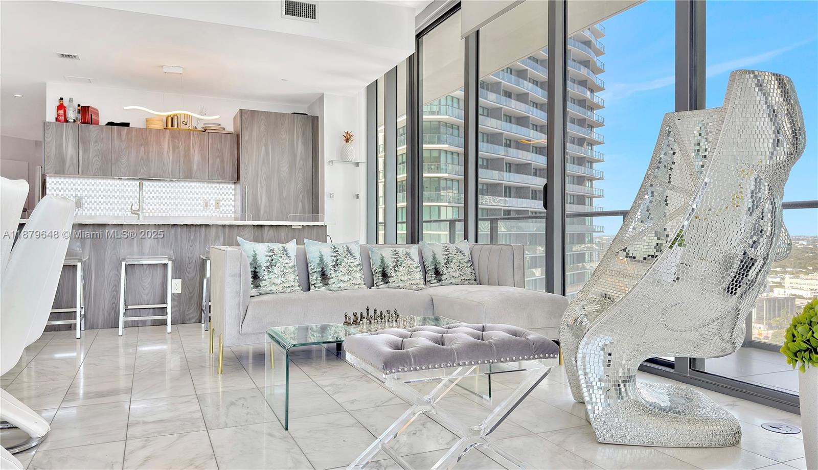 480 Northeast 31st Street, Unit 2407 Miami, FL 33137 - Photo 12 of 35 a living room with furniture and a fireplace