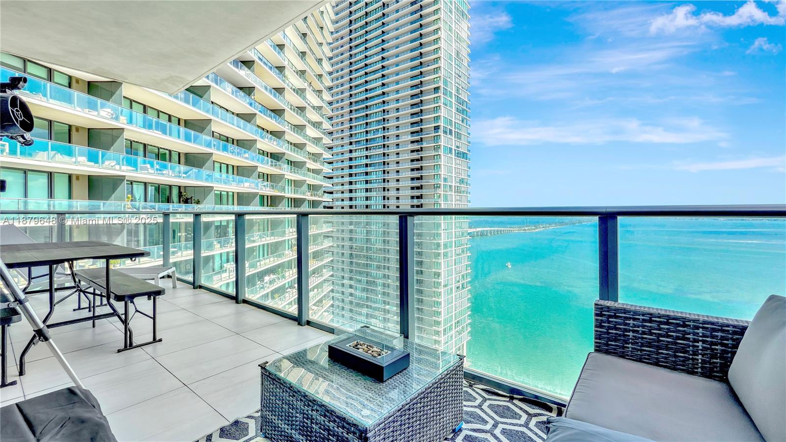 480 Northeast 31st Street, Unit 2407 Miami, FL 33137 - Photo 6 of 35 a view of a chairs and table in the balcony