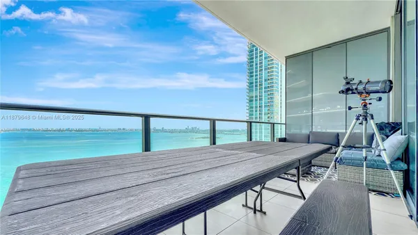 a view of a balcony with furniture