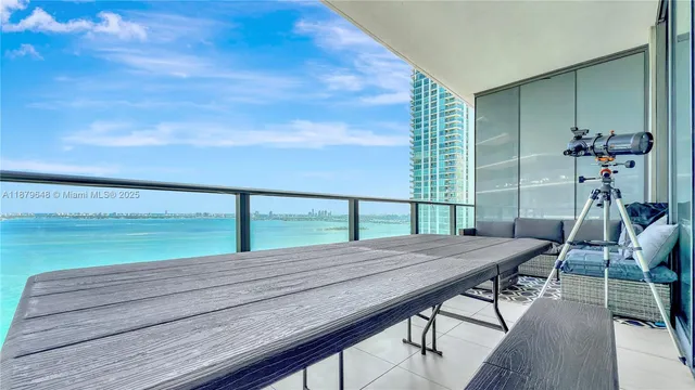 a view of a balcony with furniture