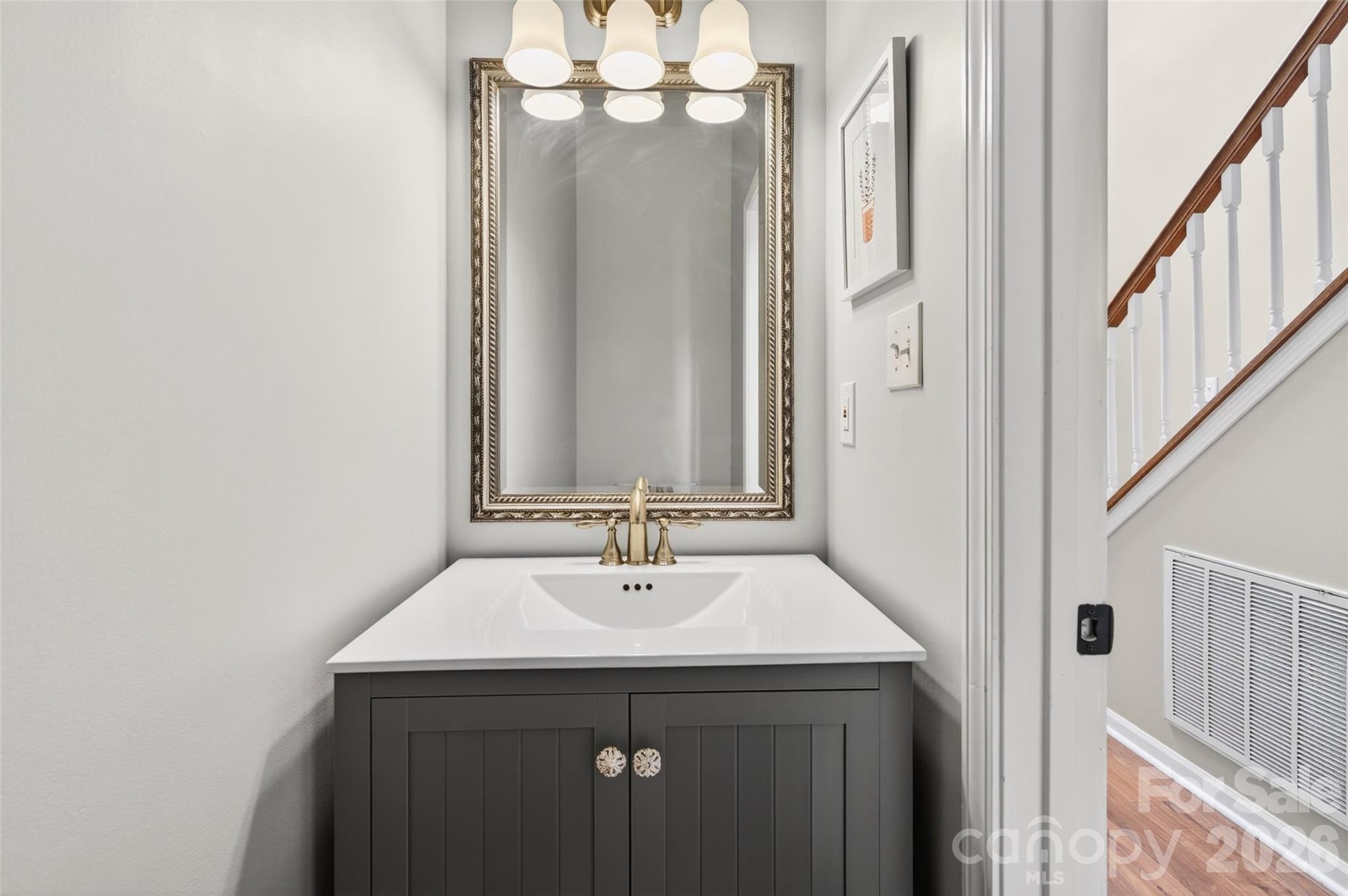 10502 Hellebore Road Charlotte, NC 28213 - Photo 15 of 48 a bathroom with a sink and a mirror