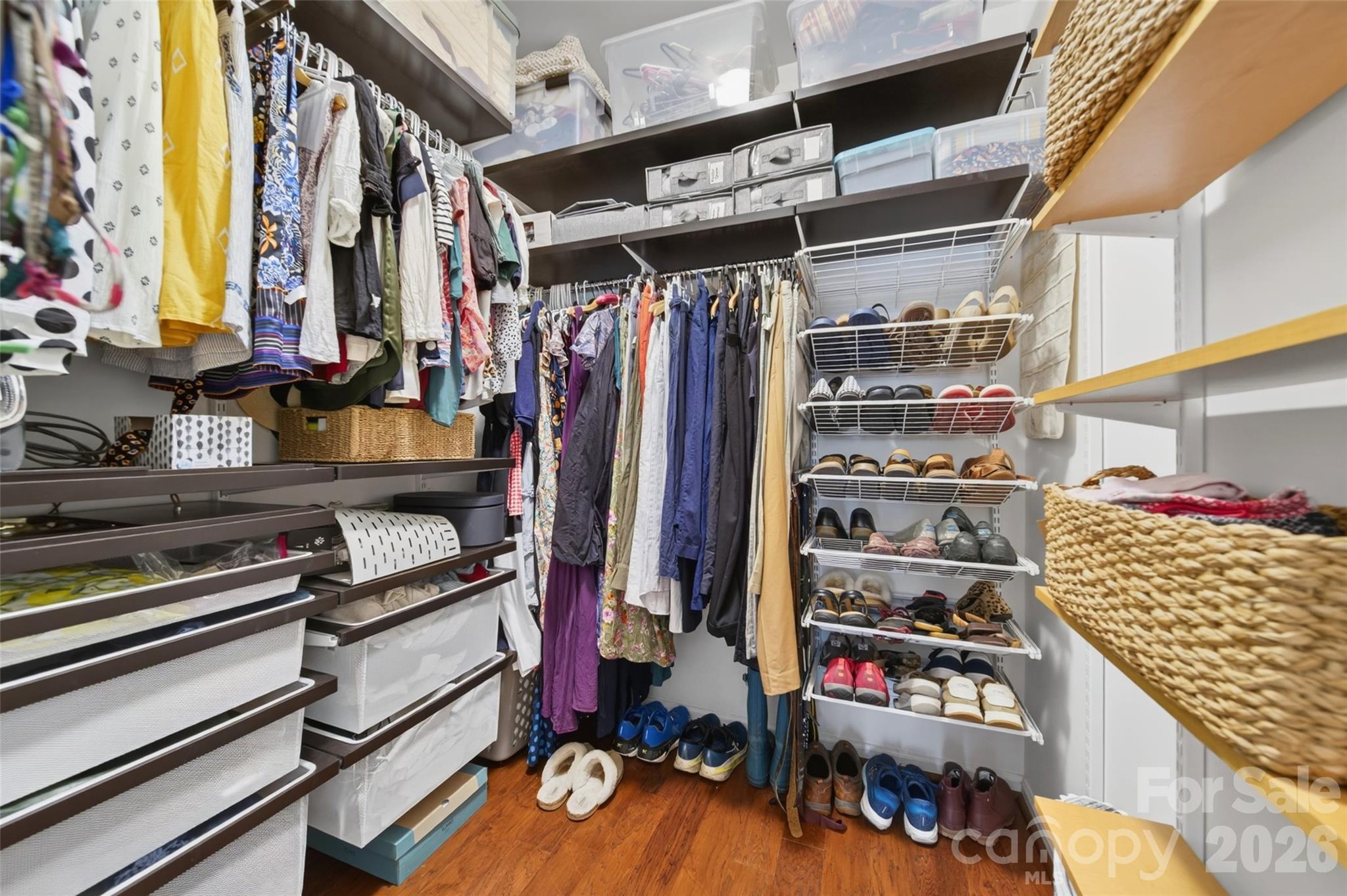 10502 Hellebore Road Charlotte, NC 28213 - Photo 23 of 48 a view of walk in closet with clothes and shoes