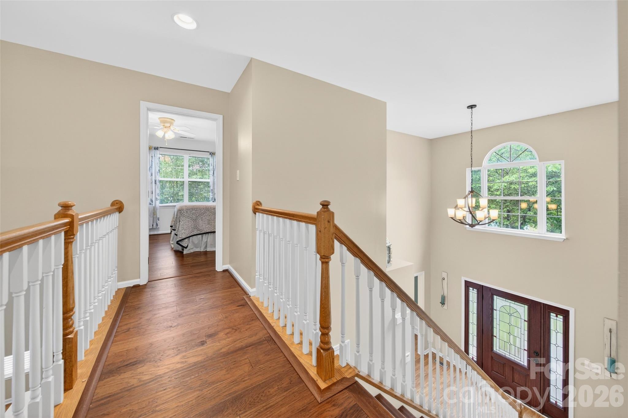 10502 Hellebore Road Charlotte, NC 28213 - Photo 24 of 48 a view of a hallway with wooden floor and staircase