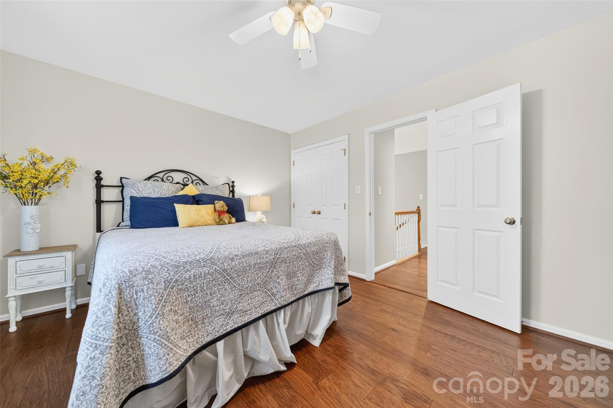 10502 Hellebore Road Charlotte, NC 28213 - Photo 26 of 48 a bedroom with a bed and a chandelier