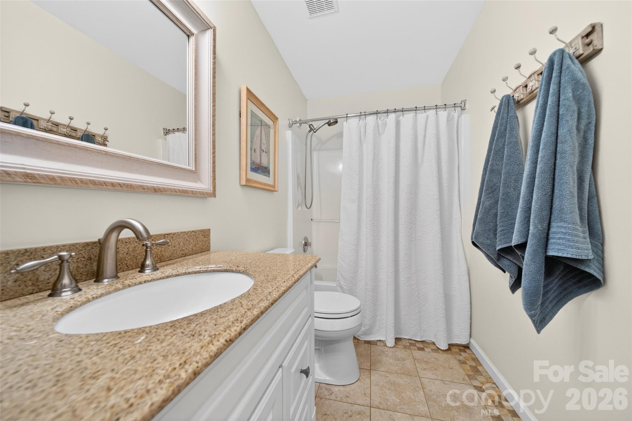 10502 Hellebore Road Charlotte, NC 28213 - Photo 29 of 48 a bathroom with a sink toilet and shower