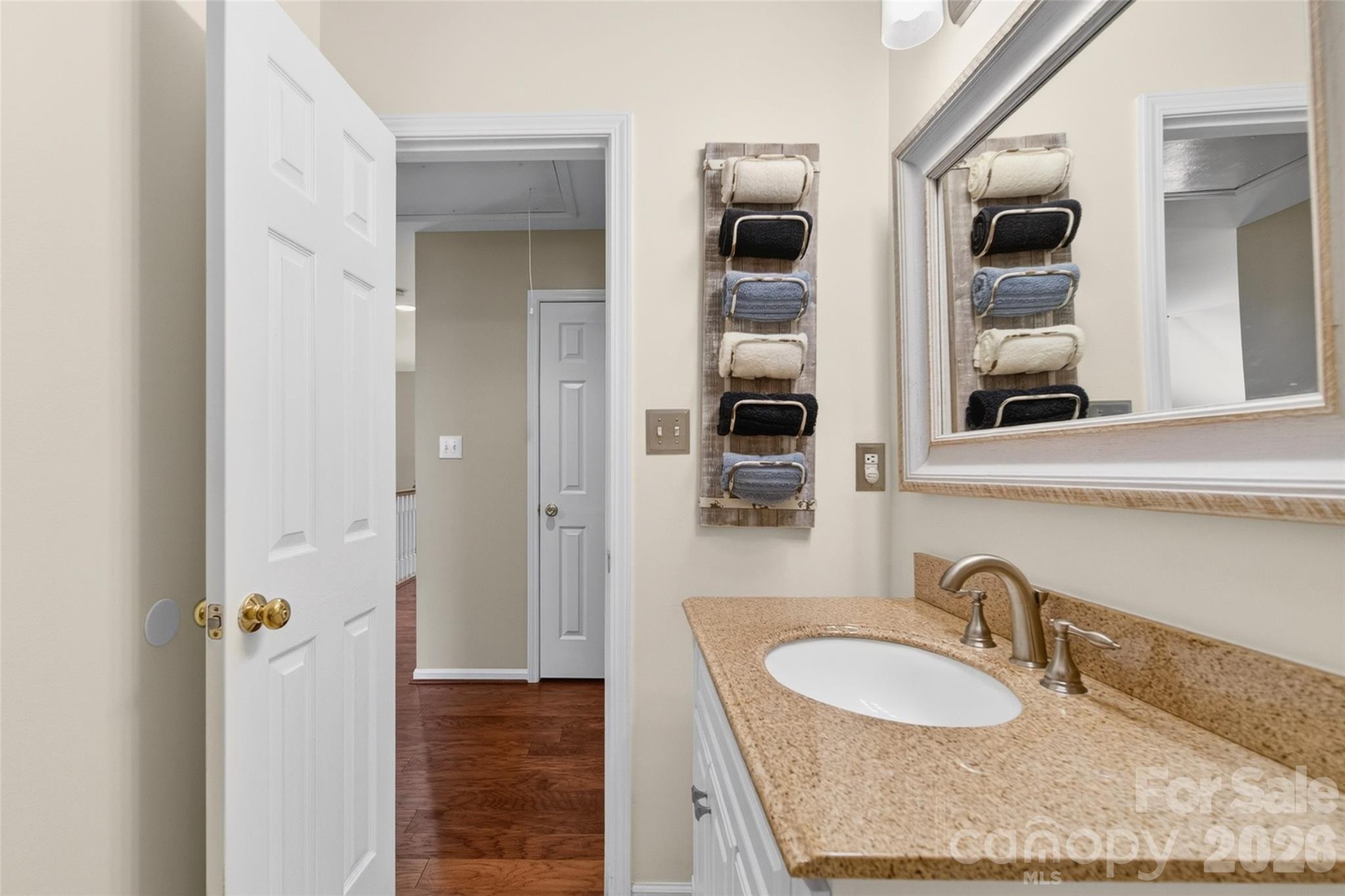 10502 Hellebore Road Charlotte, NC 28213 - Photo 30 of 48 a bathroom with a granite countertop sink