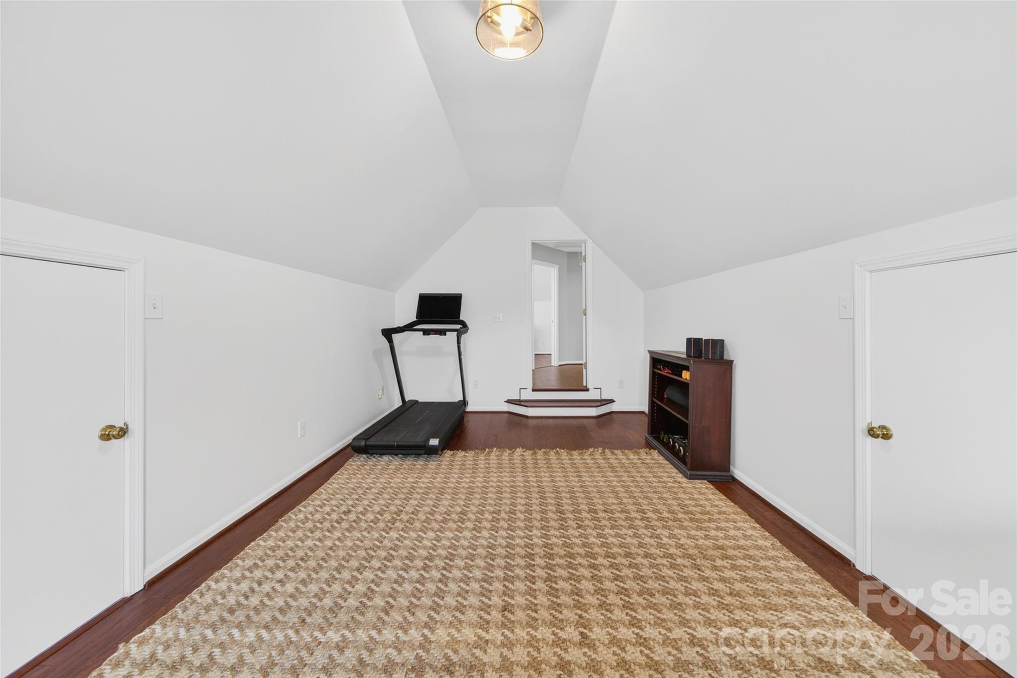 10502 Hellebore Road Charlotte, NC 28213 - Photo 33 of 48 a view of a bedroom with wooden floor and white walls