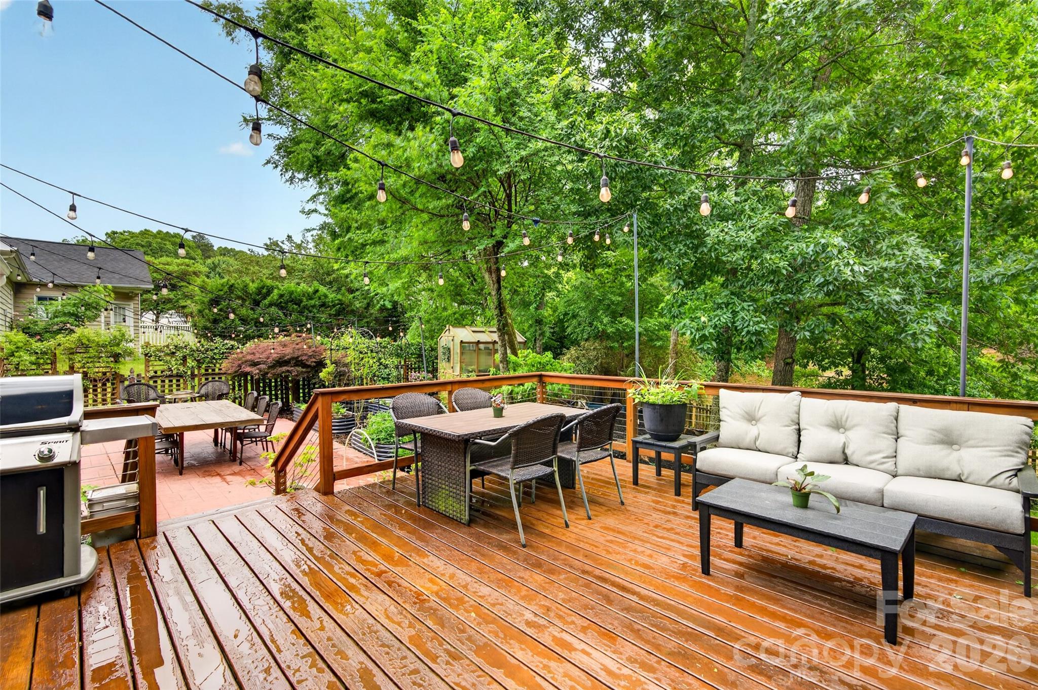 10502 Hellebore Road Charlotte, NC 28213 - Photo 35 of 48 an outdoor sitting area with furniture and wooden floor