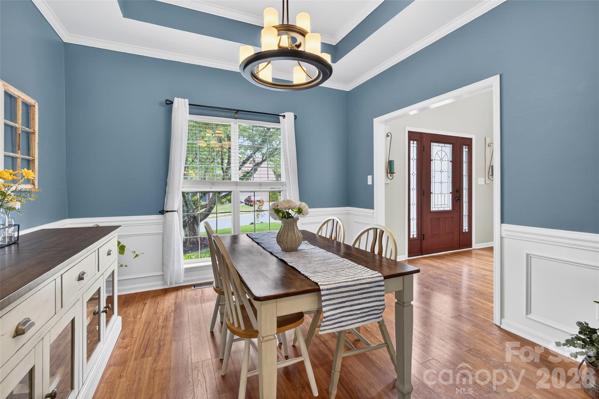 10502 Hellebore Road Charlotte, NC 28213 - Photo 5 of 48 a view of a dining room with furniture window and wooden floor