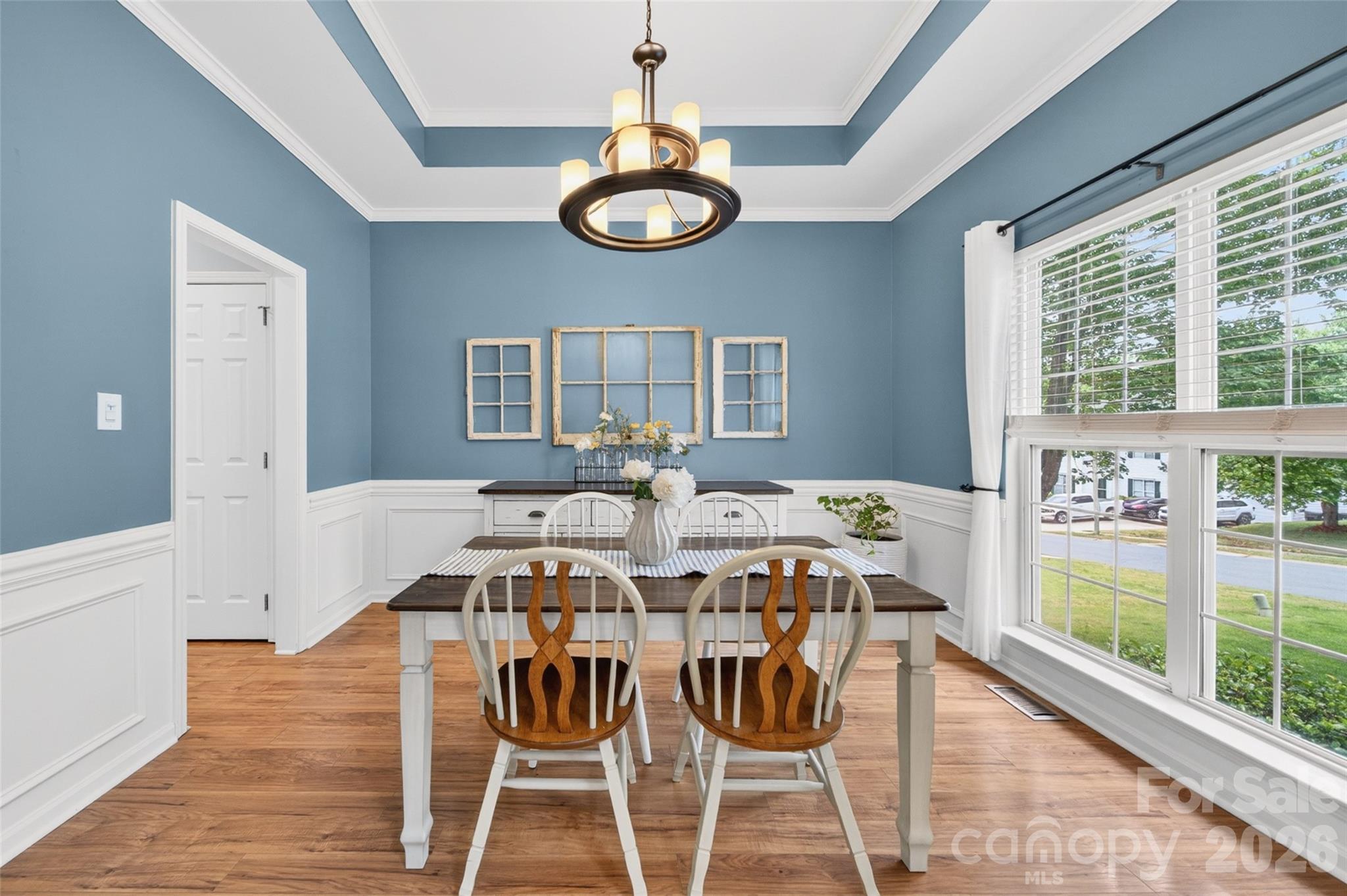 10502 Hellebore Road Charlotte, NC 28213 - Photo 6 of 48 a view of a dining room with furniture window and wooden floor