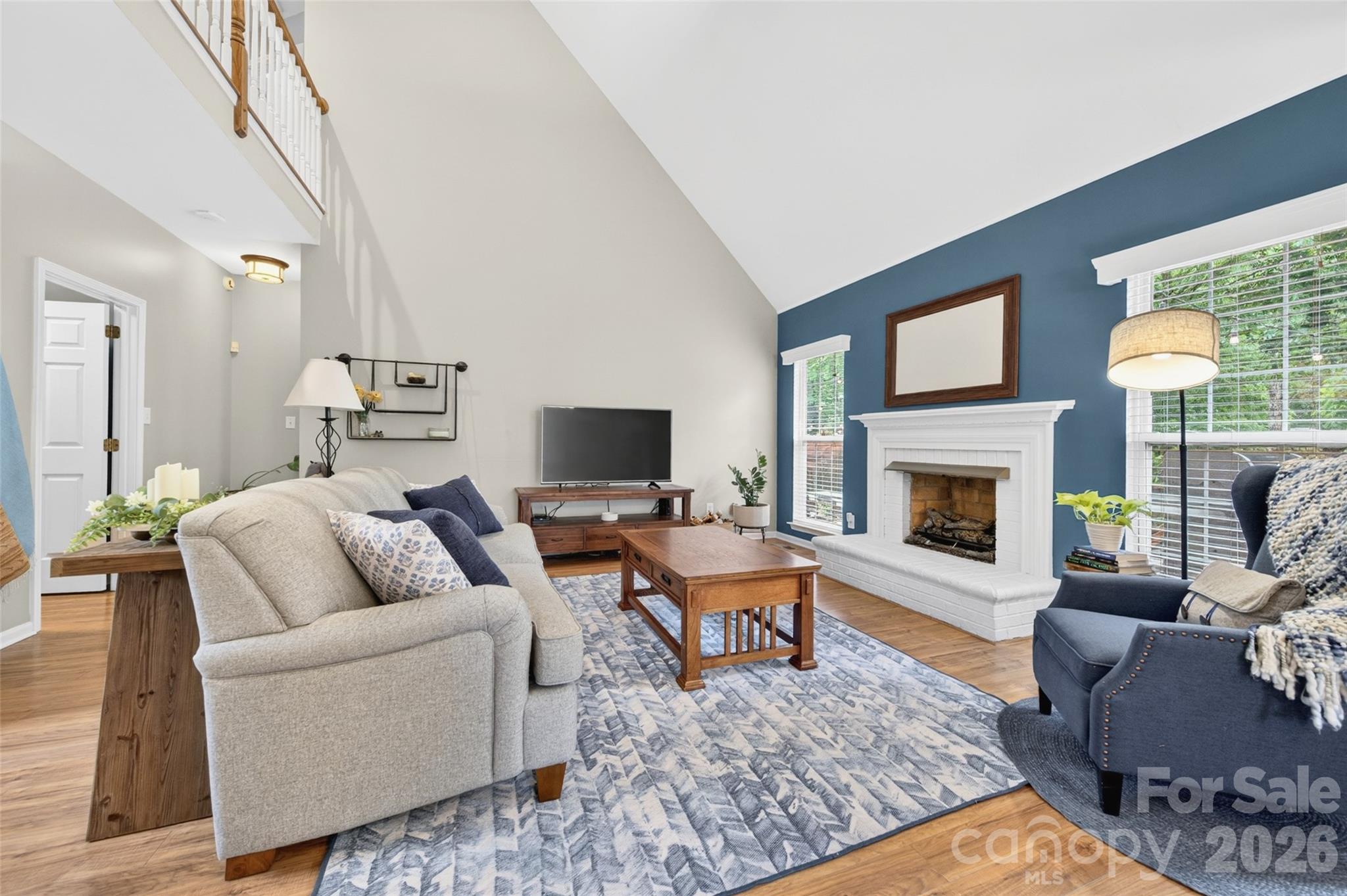10502 Hellebore Road Charlotte, NC 28213 - Photo 7 of 48 a living room with furniture or couch and a fireplace