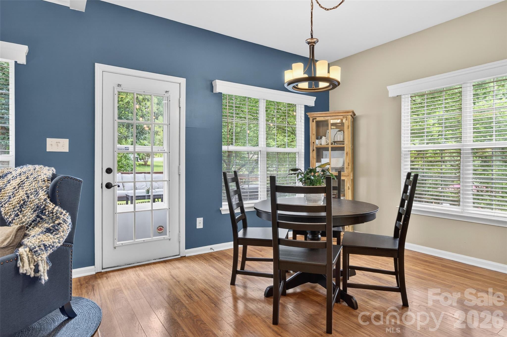 10502 Hellebore Road Charlotte, NC 28213 - Photo 10 of 48 a dining room with furniture window wooden floor
