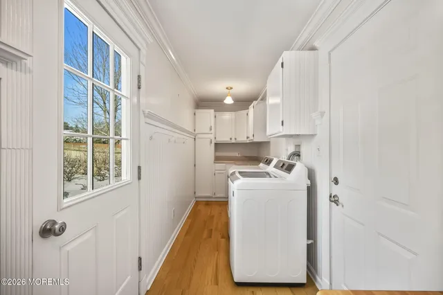a kitchen with a refrigerator a stove top oven and a sink
