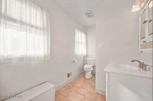 a bathroom with a sink toilet and tub