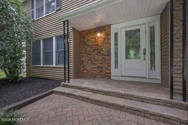 a view of backyard with porch